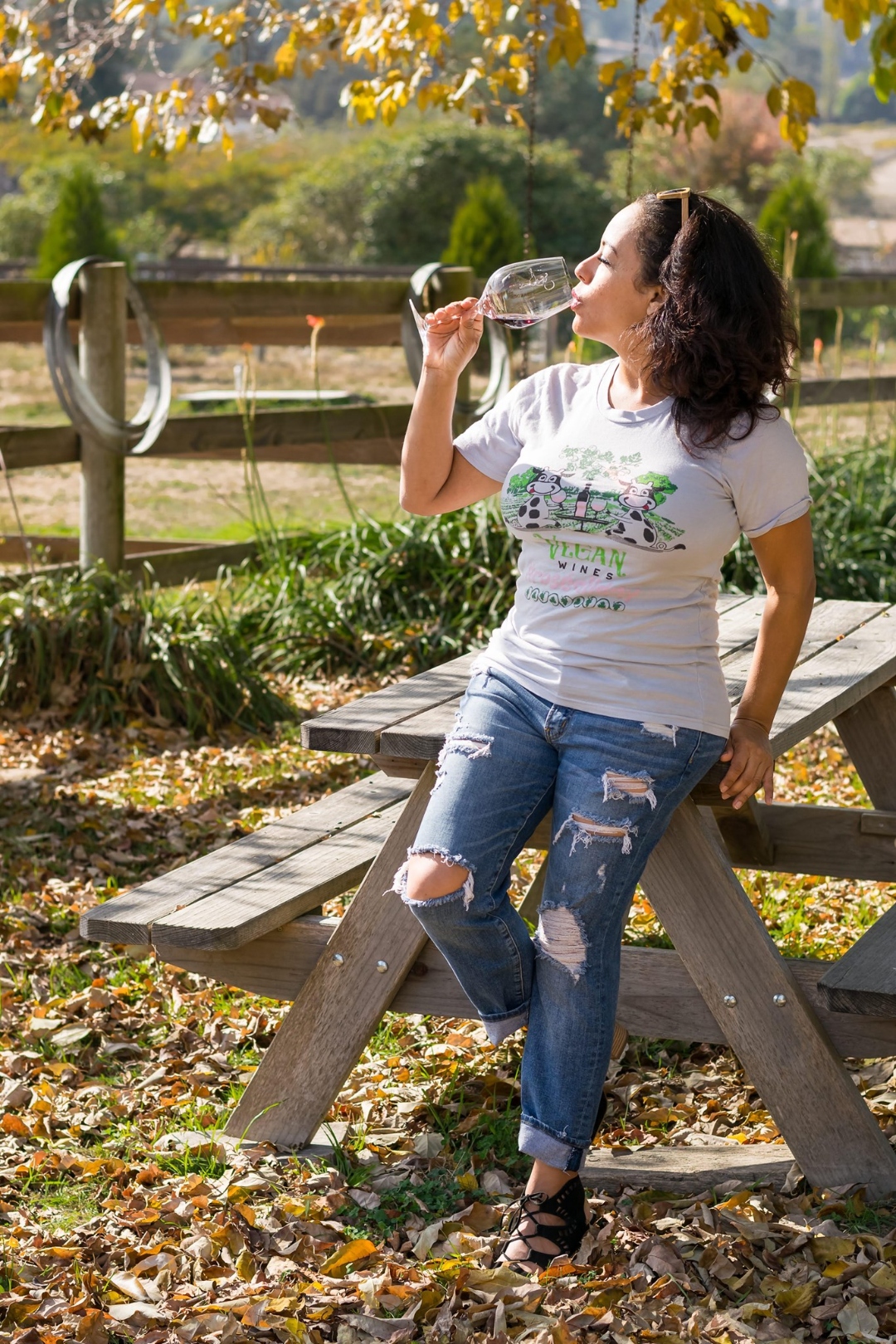 Frances Gonzalez tasting wine outdoors at a vineyard — Vegan Wines founder